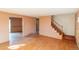 Hardwood floors flow in the living room and lead to the staircase on the second floor at 1996 S Linden Ct, Denver, CO 80224