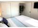 Bright bedroom featuring a bed, large closet and natural light at 2200 W Moffat Pl, Denver, CO 80221