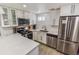 Contemporary kitchen boasting sleek white cabinetry, stainless steel appliances, and ample countertop space at 2200 W Moffat Pl, Denver, CO 80221