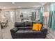 Charming living room featuring an open layout with a modern kitchen and comfortable seating at 2200 W Moffat Pl, Denver, CO 80221