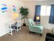 Comfortable living room area features a modern desk, chair, decor and a comfortable accent chair at 2200 W Moffat Pl, Denver, CO 80221