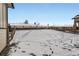Snowy backyard with a wooden fence and expansive space for outdoor activities at 17402 W 93Rd Pl, Arvada, CO 80007