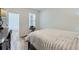 Bright bedroom features a large window, neutral decor, and a cozy, inviting atmosphere at 17402 W 93Rd Pl, Arvada, CO 80007