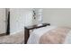 Bright bedroom featuring a closet with sliding doors and neutral carpeting at 17402 W 93Rd Pl, Arvada, CO 80007