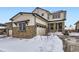 Beautiful two-story home featuring stone accents, a front porch, and an attached two-car garage at 17402 W 93Rd Pl, Arvada, CO 80007