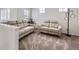 Comfortable upstairs living area with plush carpet and stylish, cushioned seating at 17402 W 93Rd Pl, Arvada, CO 80007
