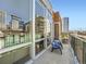 Spacious balcony with city views through large windows and open doorway at 1401 Delgany St # 409, Denver, CO 80202