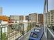 Balcony area with seating and views of surrounding buildings in an urban setting at 1401 Delgany St # 409, Denver, CO 80202