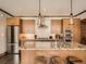 Bright kitchen boasts stainless steel appliances, custom cabinetry, and an inviting central island with seating at 1401 Delgany St # 409, Denver, CO 80202