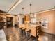 Spacious kitchen featuring granite countertops, stainless steel appliances, and an island with barstool seating at 1401 Delgany St # 409, Denver, CO 80202