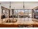 Modern kitchen with granite countertop, stainless steel appliances, and exposed brick accents at 1401 Delgany St # 409, Denver, CO 80202