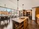 Open living space featuring a kitchen island, dining area, and a view of the city skyline at 1401 Delgany St # 409, Denver, CO 80202