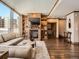 Cozy living room with brick fireplace, custom built-ins, and hardwood flooring at 1401 Delgany St # 409, Denver, CO 80202