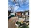 Backyard featuring a small wooden deck, a shed and various garden elements at 12116 W Texas Dr, Lakewood, CO 80228