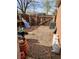 A gravel area with a wooden fence and space for storage or landscaping at 12116 W Texas Dr, Lakewood, CO 80228