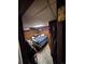 Bedroom with a bed, closet, and storage items, offering a glimpse of a sleeping space at 12116 W Texas Dr, Lakewood, CO 80228