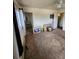 A bedroom with a ceiling fan and pictures on the floor, with a view to the bathroom at 12116 W Texas Dr, Lakewood, CO 80228
