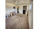 A bedroom with a ceiling fan and pictures on the floor, with a closet space at 12116 W Texas Dr, Lakewood, CO 80228