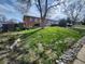 Brick home with a large tree in the front yard and landscaped with rocks on the side at 12116 W Texas Dr, Lakewood, CO 80228