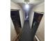 Hallway with two open doorways, showing unfinished space at 12116 W Texas Dr, Lakewood, CO 80228