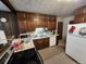 Functional kitchen with traditional cabinetry, full range of appliances, and ready for Gathering meals at 12116 W Texas Dr, Lakewood, CO 80228