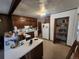 Functional kitchen featuring traditional cabinetry, ample countertop space, and a convenient walk-in pantry at 12116 W Texas Dr, Lakewood, CO 80228