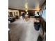 The living room boasts ample space, natural light, and an easy view to the kitchen at 12116 W Texas Dr, Lakewood, CO 80228