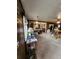 Charming living area with an open kitchen view, blending natural light with classic interior design at 12116 W Texas Dr, Lakewood, CO 80228