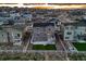 A high angle shot of a two-story home's backyard with patio, lawn, and surrounding community at 5256 Trails Edge Ln, Castle Rock, CO 80104