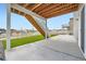 Open back patio area with green turf and a view of the backyard and neighborhood at 5256 Trails Edge Ln, Castle Rock, CO 80104