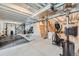 Unfinished basement space with exposed ceiling beams and exercise equipment at 5256 Trails Edge Ln, Castle Rock, CO 80104