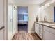Bright bathroom features dual sinks with granite counters, tiled floors, and a shower at 5256 Trails Edge Ln, Castle Rock, CO 80104