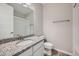 Bright bathroom with a granite countertop, a modern sink, and a tiled shower/tub combo at 5256 Trails Edge Ln, Castle Rock, CO 80104