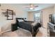 Bedroom with neutral walls, carpet, a window, and a black bed with dark linens at 5256 Trails Edge Ln, Castle Rock, CO 80104