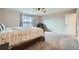 Bedroom featuring a cozy recliner chair, carpeted flooring, and a bright window at 5256 Trails Edge Ln, Castle Rock, CO 80104