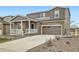 Beautiful two-story home with stone accents and a well-maintained front yard at 5256 Trails Edge Ln, Castle Rock, CO 80104