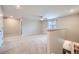 Spacious, carpeted loft area with a ceiling fan, neutral walls, and access to the upper level at 5256 Trails Edge Ln, Castle Rock, CO 80104