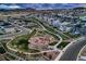 Overhead view of a neighborhood park featuring a playground, walking trails, and beautifully landscaped green spaces at 5256 Trails Edge Ln, Castle Rock, CO 80104