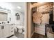 Well-organized bathroom with walk-in closet featuring custom shelving at 1301 Speer Blvd # 309, Denver, CO 80204