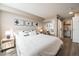 Comfortable bedroom with sliding closet doors and a view of a closet at 1301 Speer Blvd # 309, Denver, CO 80204