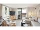 Comfortable living room with plush seating and sliding glass doors to a balcony at 1301 Speer Blvd # 309, Denver, CO 80204