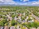 Charming neighborhood view with a home location marked by a red arrow, nestled among lush trees at 655 Gooseberry Ct, Lafayette, CO 80026