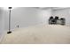 Spacious basement featuring plush carpeting, ample natural light, and neutral-toned decor at 655 Gooseberry Ct, Lafayette, CO 80026