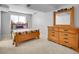 Bedroom featuring bed, dresser and window providing natural light at 655 Gooseberry Ct, Lafayette, CO 80026
