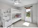 Bright bedroom featuring bunk beds, ample natural light, and neutral-toned decor at 655 Gooseberry Ct, Lafayette, CO 80026