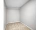 Empty walk-in closet with carpet flooring, rod for hanging clothes, and white walls at 655 Gooseberry Ct, Lafayette, CO 80026