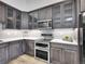 Modern kitchen with gray cabinets, stainless appliances, and sleek countertops at 655 Gooseberry Ct, Lafayette, CO 80026
