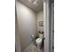 Powder room featuring a toilet, wall art, toilet paper holder, and ceiling fan at 12901 Crane River Dr, Longmont, CO 80504