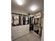 Walk-in closet with shelves, drawers, clothing racks, and carpet flooring at 12901 Crane River Dr, Longmont, CO 80504