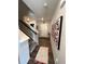 Bright entryway features wood floors, a colorful rug, and a staircase, adding a touch of style to the home at 12901 Crane River Dr, Longmont, CO 80504